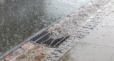 a gully with rainwater draining into it